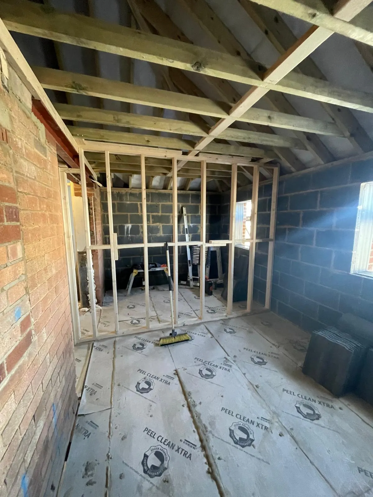 Stud partition framing going up in a garage conversion