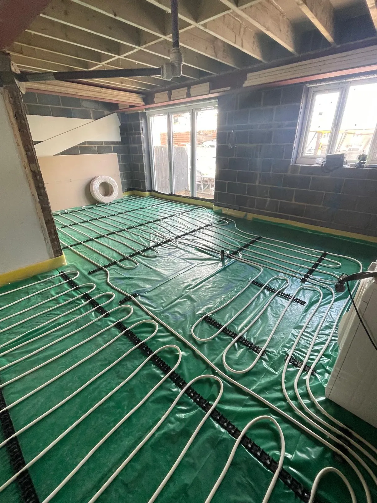 Underfloor heating pipes laid out ready for screed